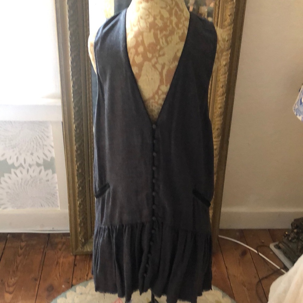 Free People . Looks great with white tee or tank underneath .